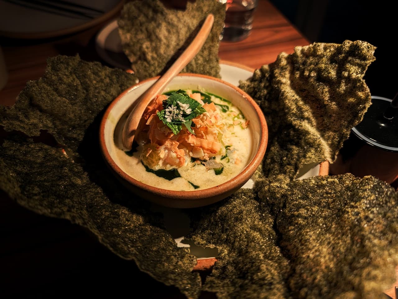 Gourmet dish with seaweed chips and creamy seafood in a bowl in San Francisco
