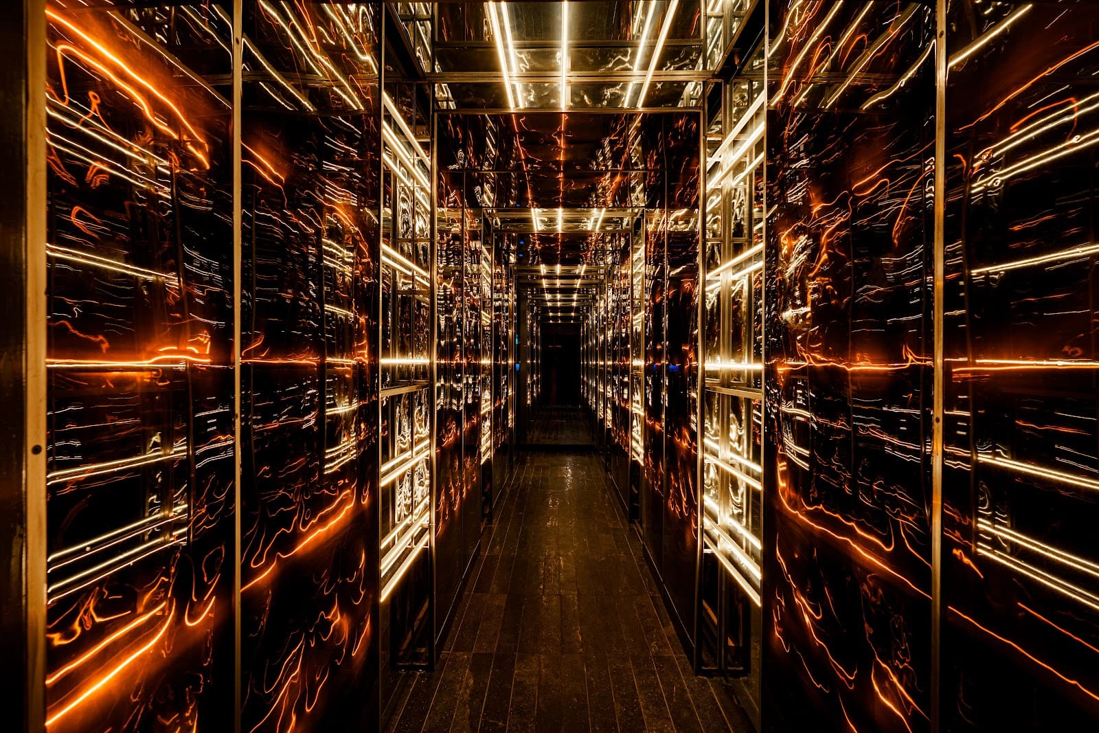 Hallway with reflective walls and warm lighting in Toronto