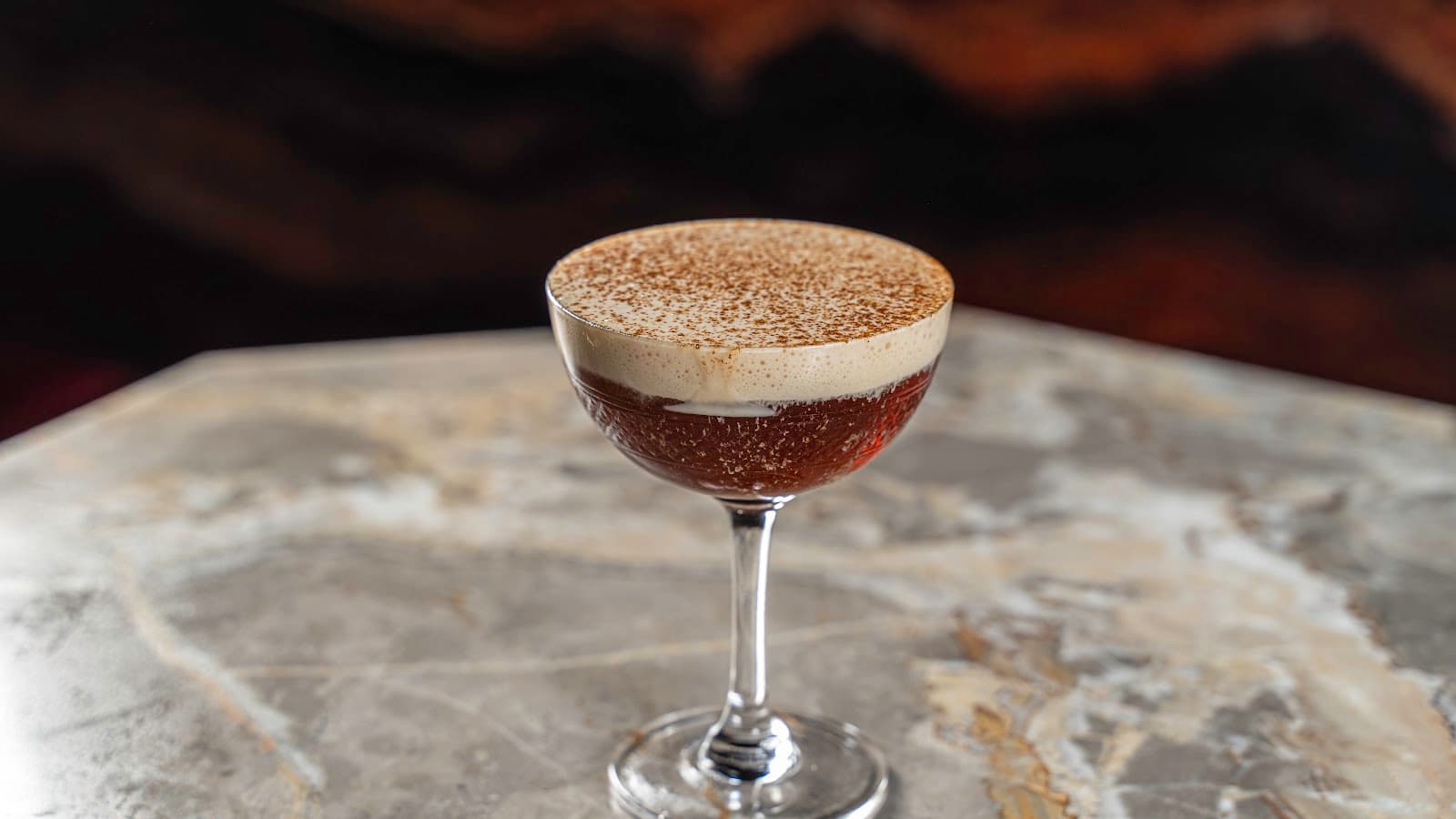 Close-up of a creamy cocktail on a marble surface in Toronto