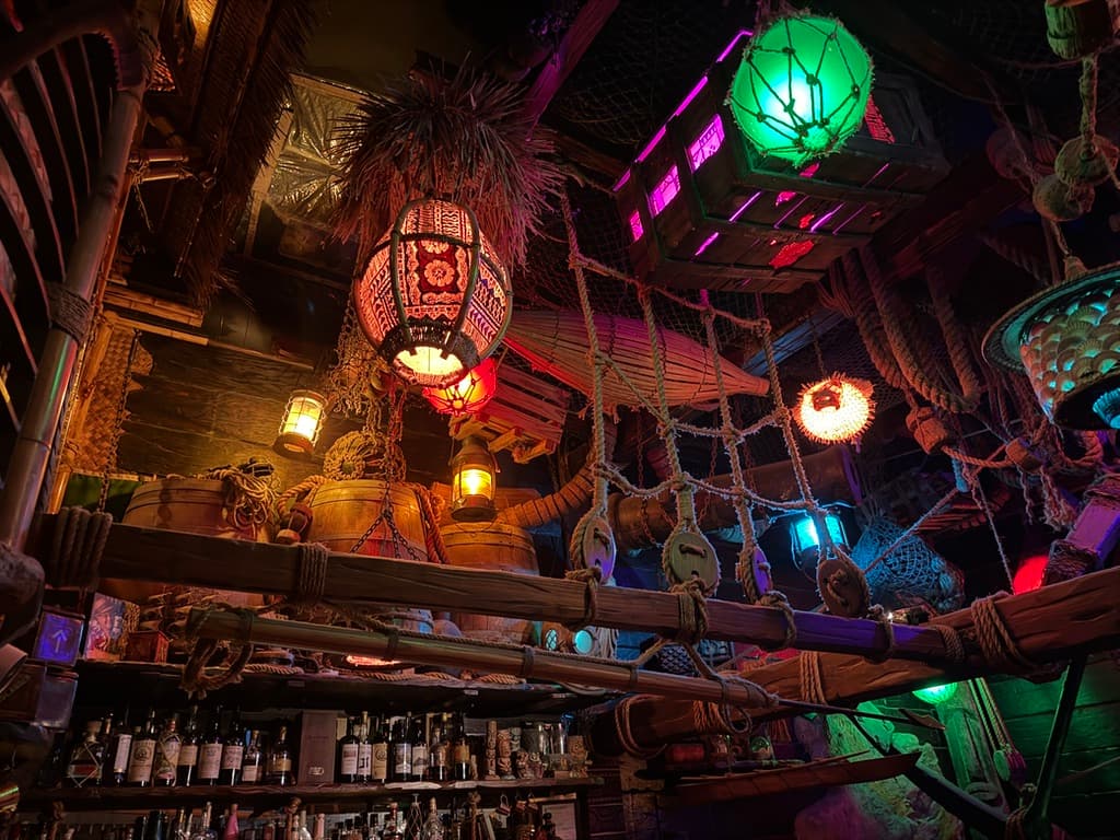 Colorful tiki bar with hanging lanterns and ropes creating a nautical theme in San Francisco