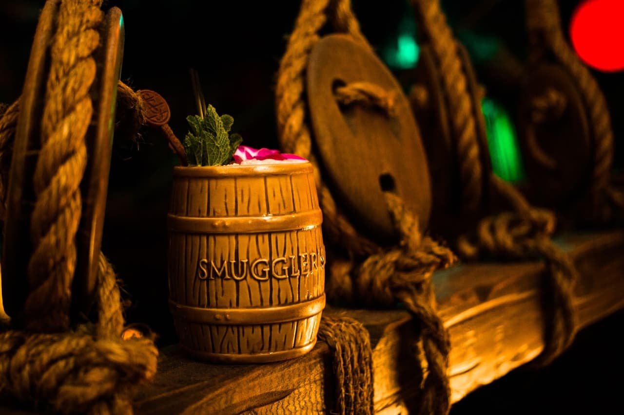 Barrel-shaped cocktail with ropes and rustic background at Smuggler's in San Francisco