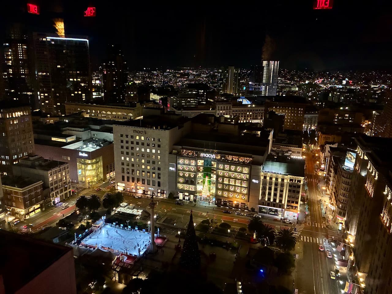 Night cityscape view from a high window overlooking illuminated buildings and streets in San Francisco