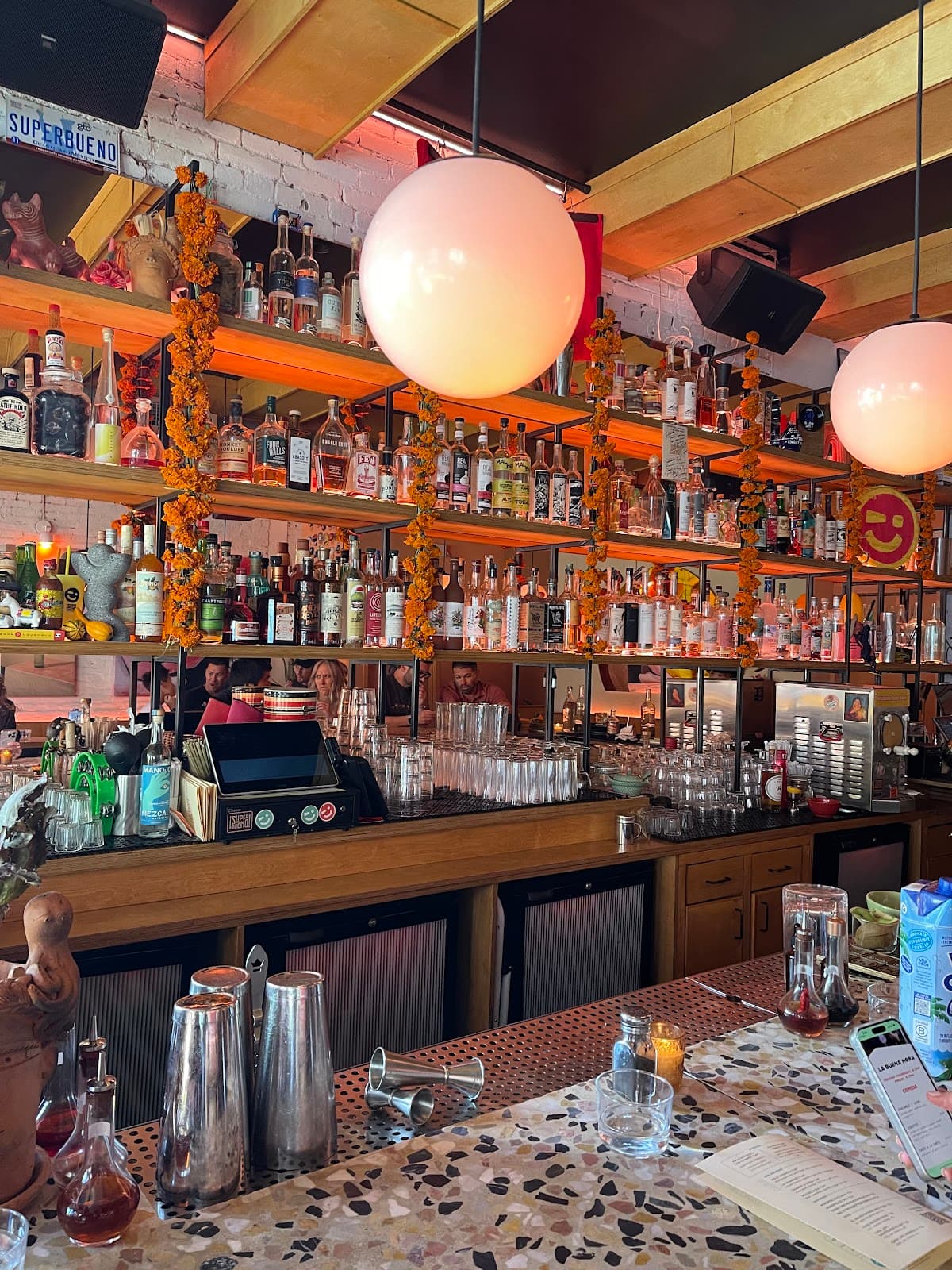 SUPERBUENO bar area with cocktails and spirits selection in New York