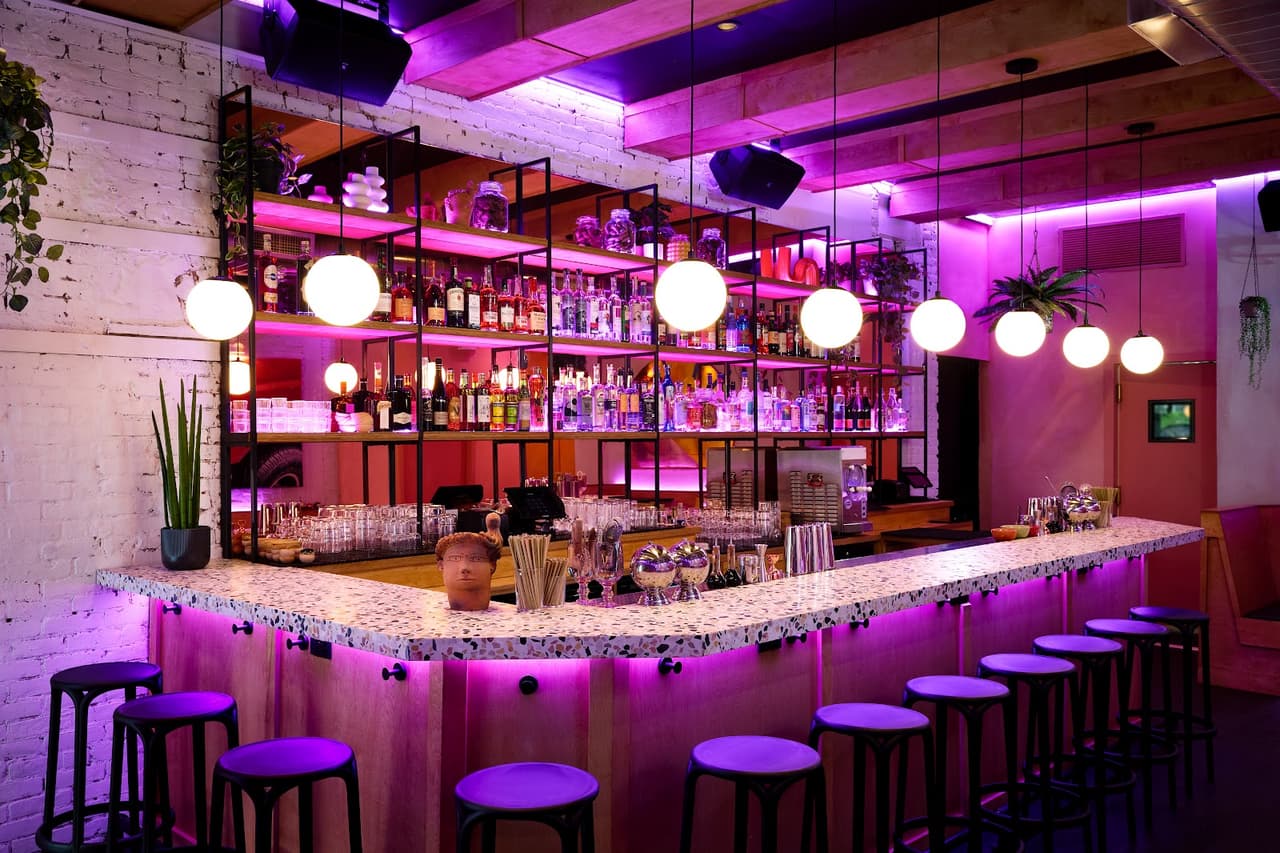 SUPERBUENO bar area with cocktails and spirits selection