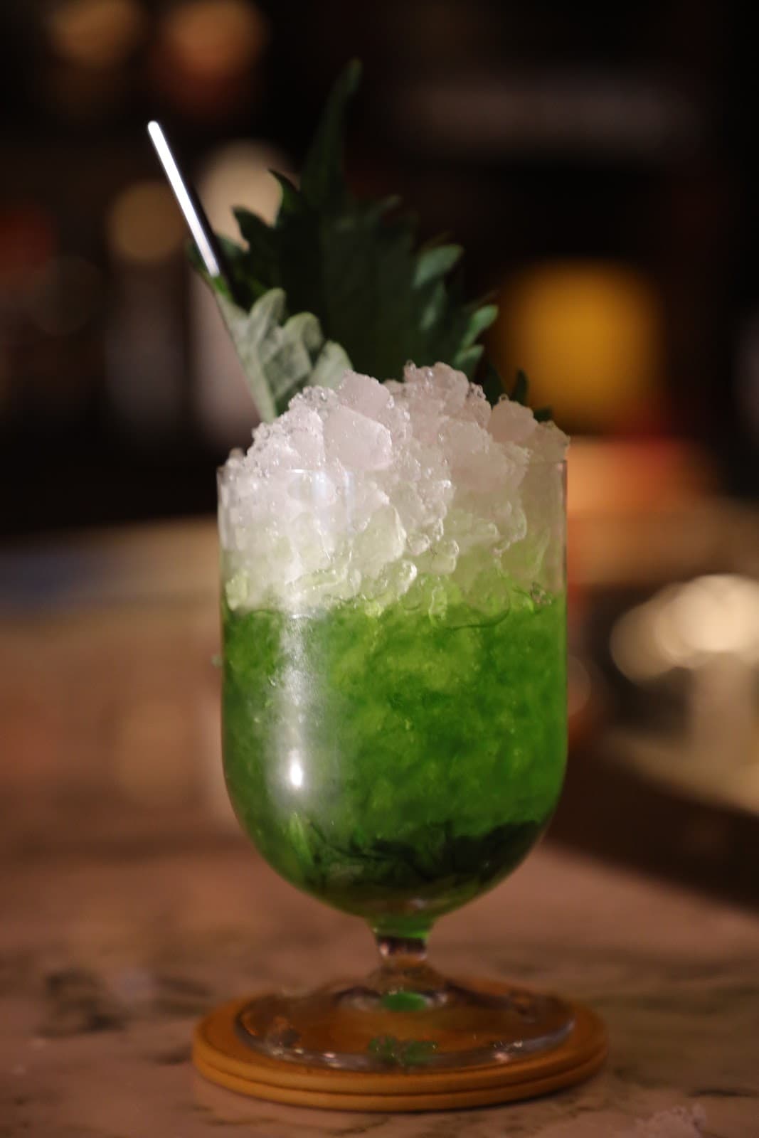 Close-up of a green cocktail with crushed ice in a glass in London