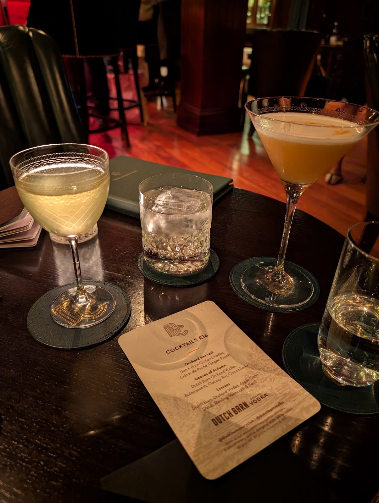 Assorted cocktails on a dark table at an upscale bar in London