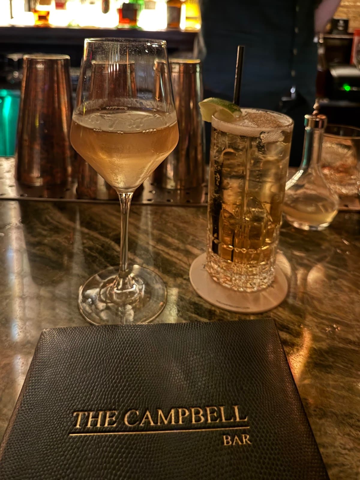 Close-up of cocktails and a bar menu at The Campbell Bar in New York