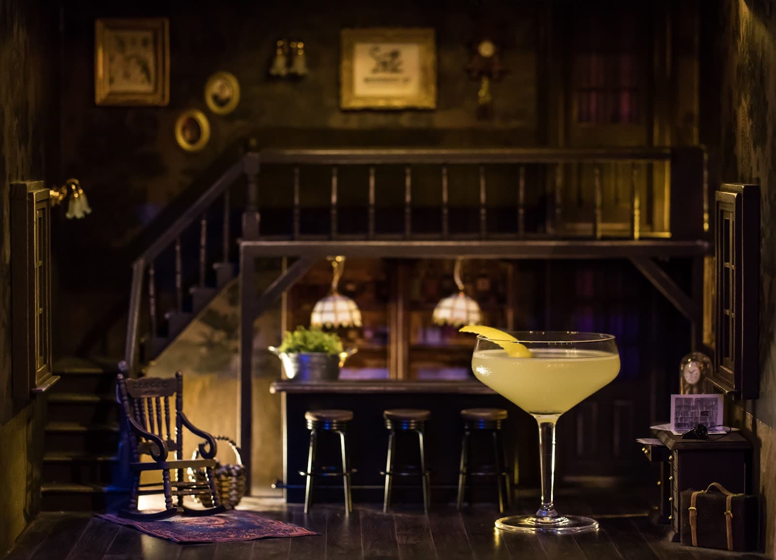 Stylish cocktail with lemon twist in dimly lit vintage bar setting
