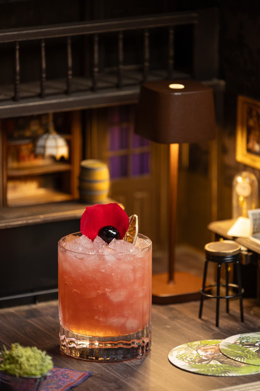 Close-up of a cocktail with garnish in a dim interior setting in London